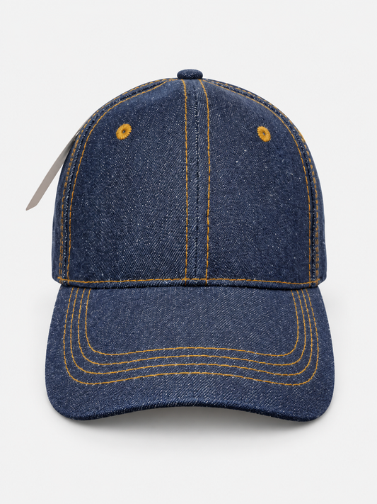 Blue denim baseball cap with contrast stitching on a light gray background