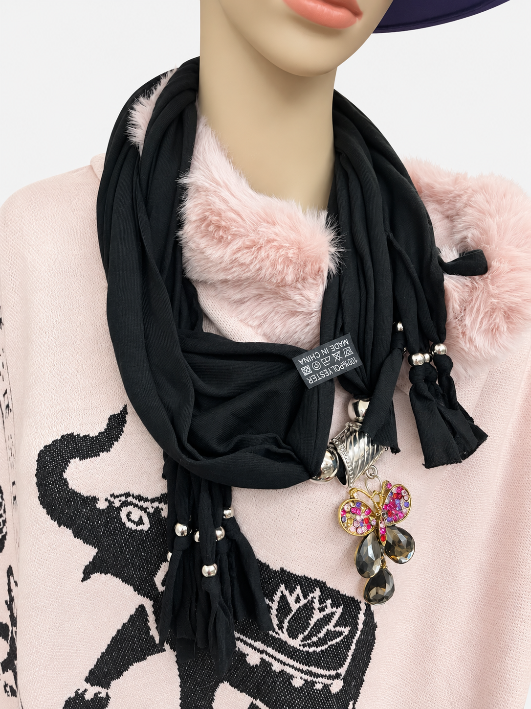 Black butterfly pendant scarf worn on a mannequin, showing pendant and beaded tassels