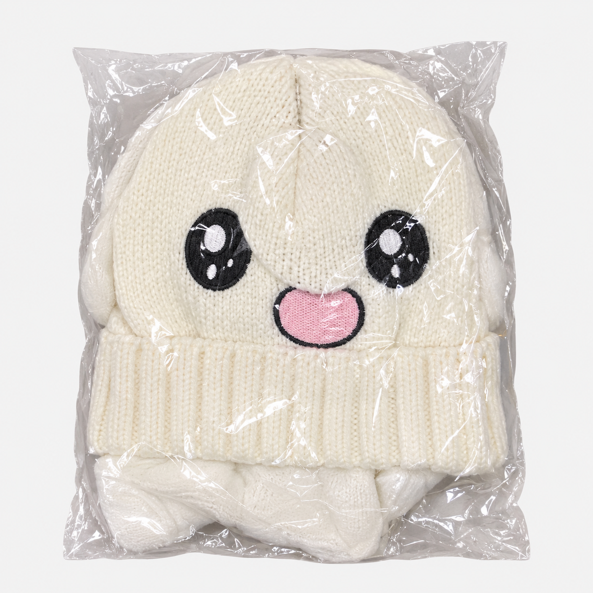 Cream happy-face knit hat in individual packaging