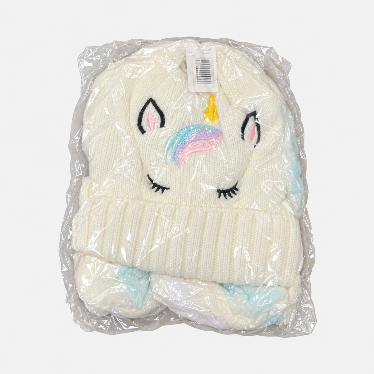 Cream unicorn knit hat in individual packaging