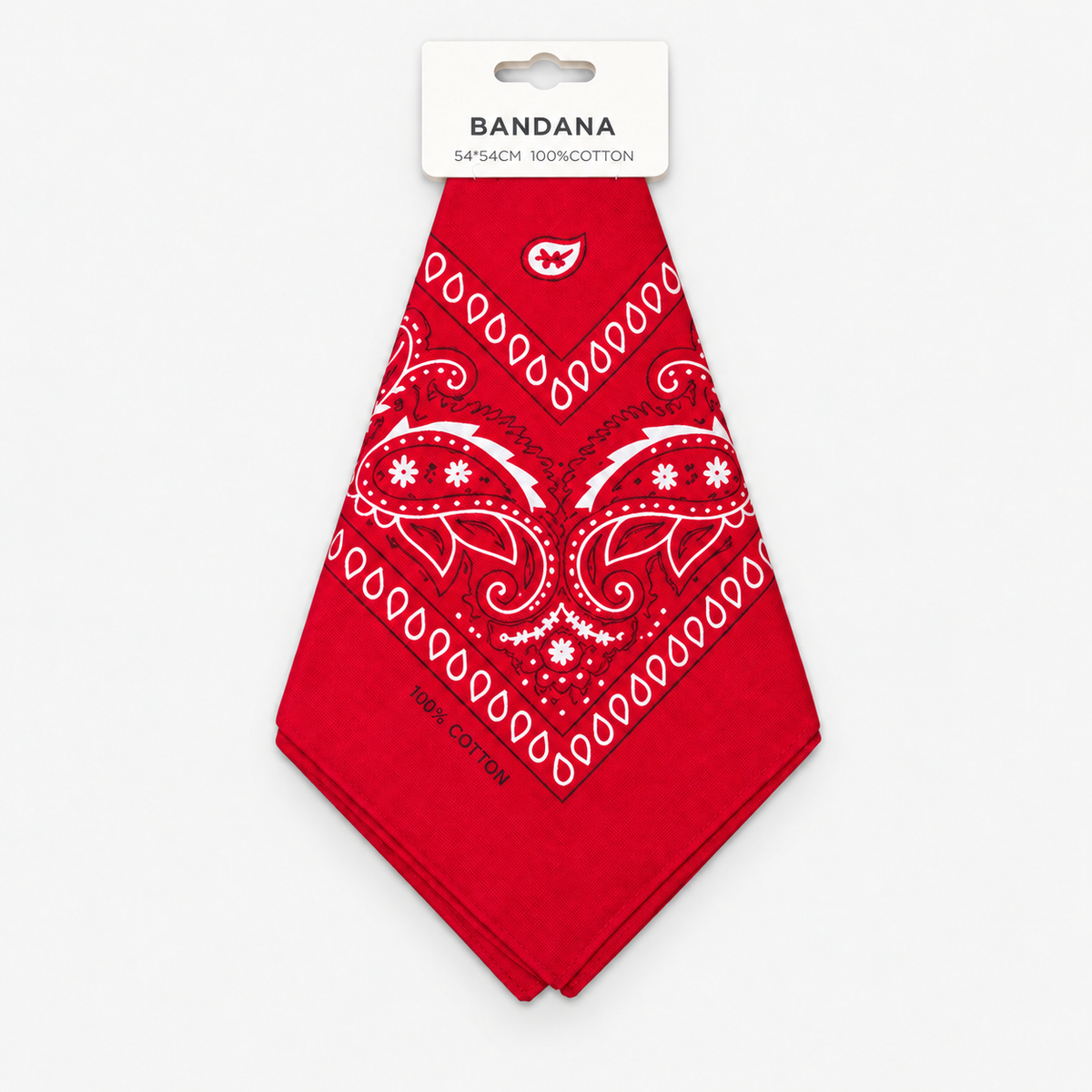 One red cotton paisley bandana with retail hang tag on a light gray background.