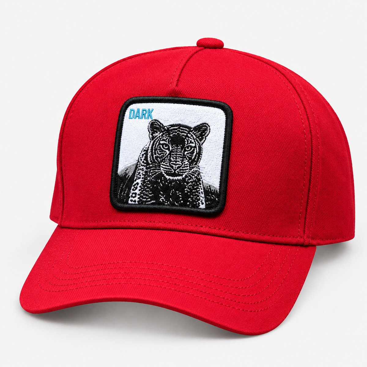 Red panther patch baseball cap with DARK lettering, facing left