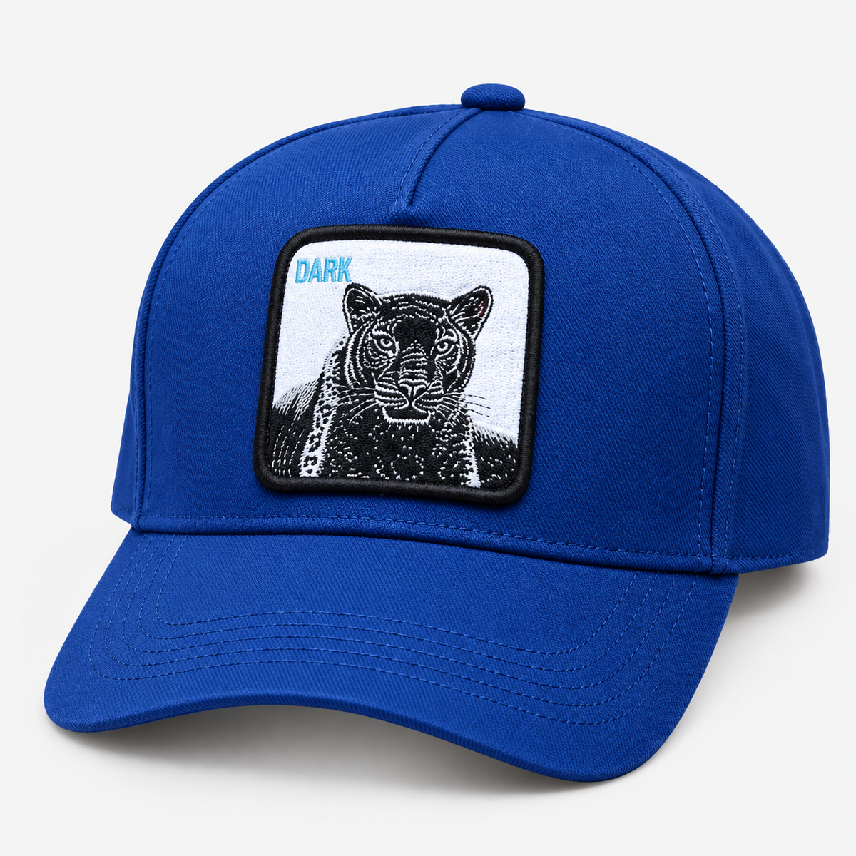 Royal blue panther patch baseball cap with DARK lettering, facing left