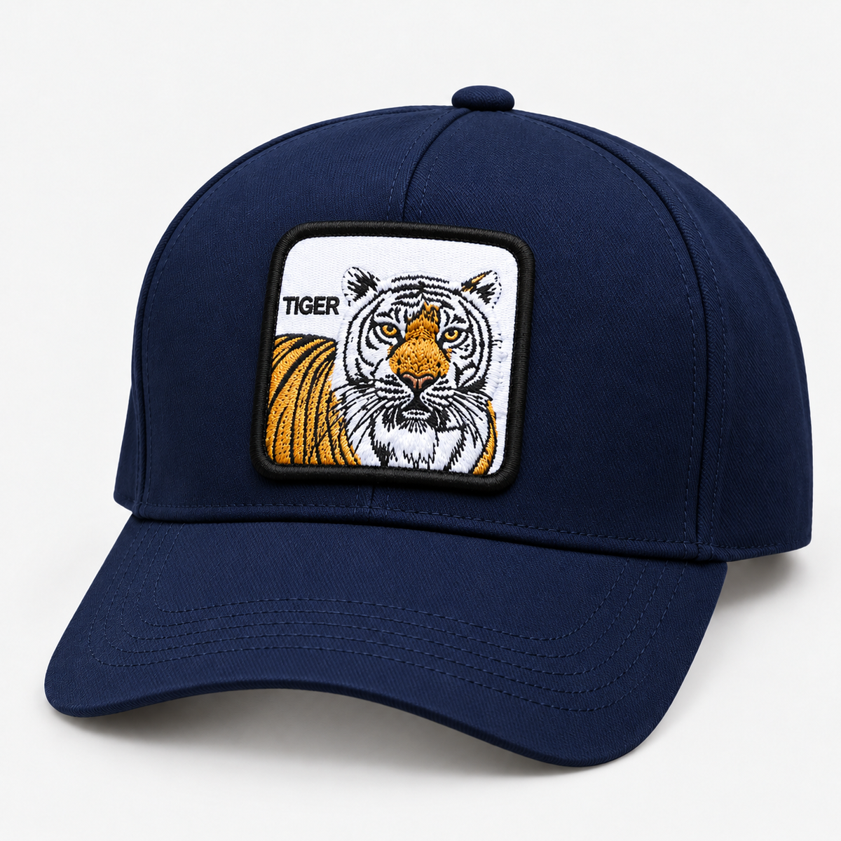 Navy tiger patch baseball cap with curved brim, facing left