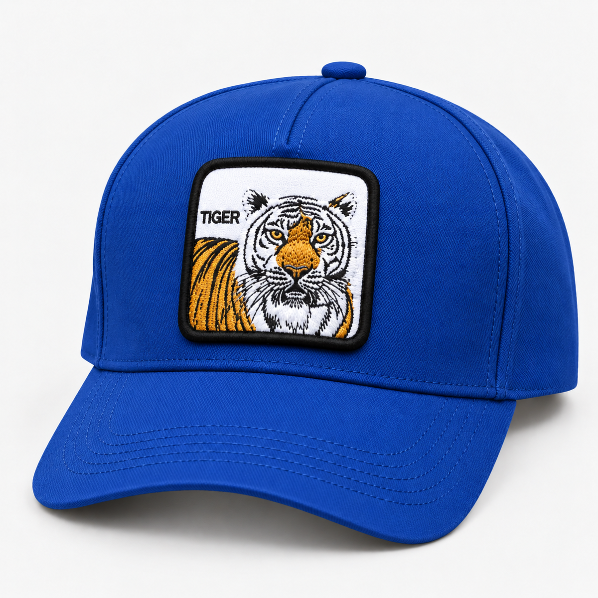 Royal blue tiger patch baseball cap with curved brim, facing left