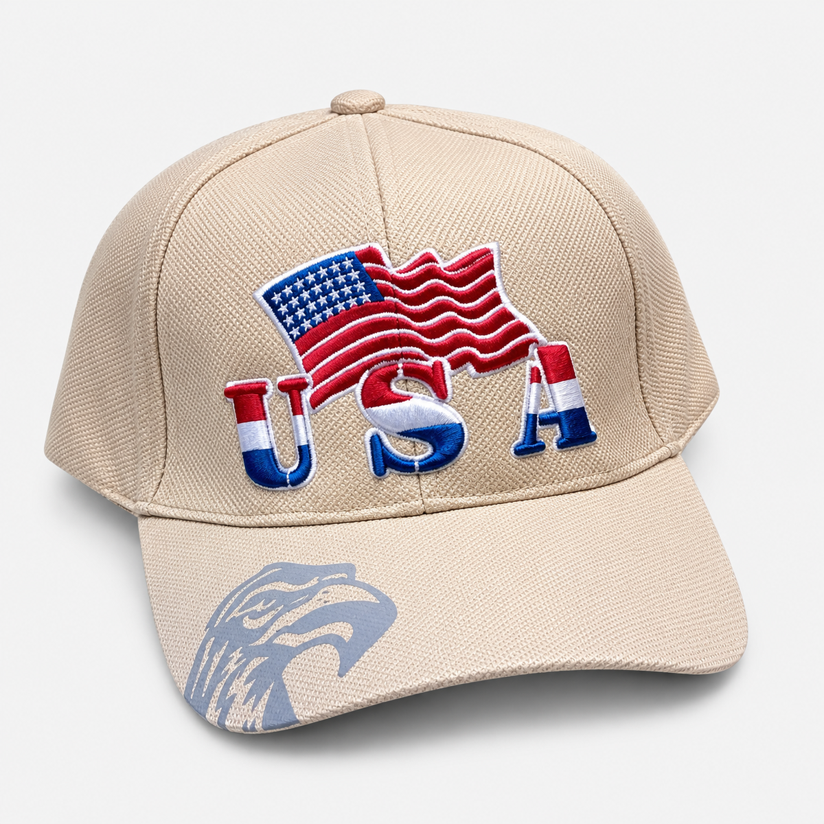 Beige baseball cap with embroidered USA lettering, an American flag and an eagle graphic on the brim