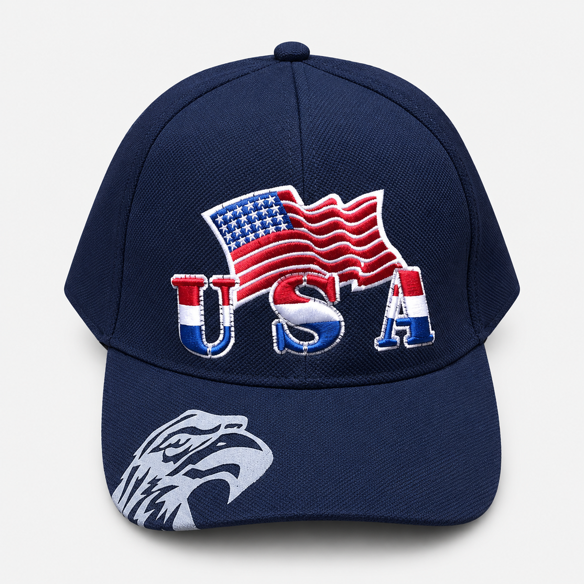 Navy baseball cap with embroidered USA lettering, an American flag and an eagle graphic on the brim
