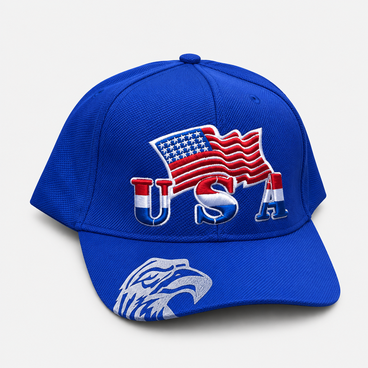 Royal blue baseball cap with embroidered USA lettering, an American flag and an eagle graphic on the brim