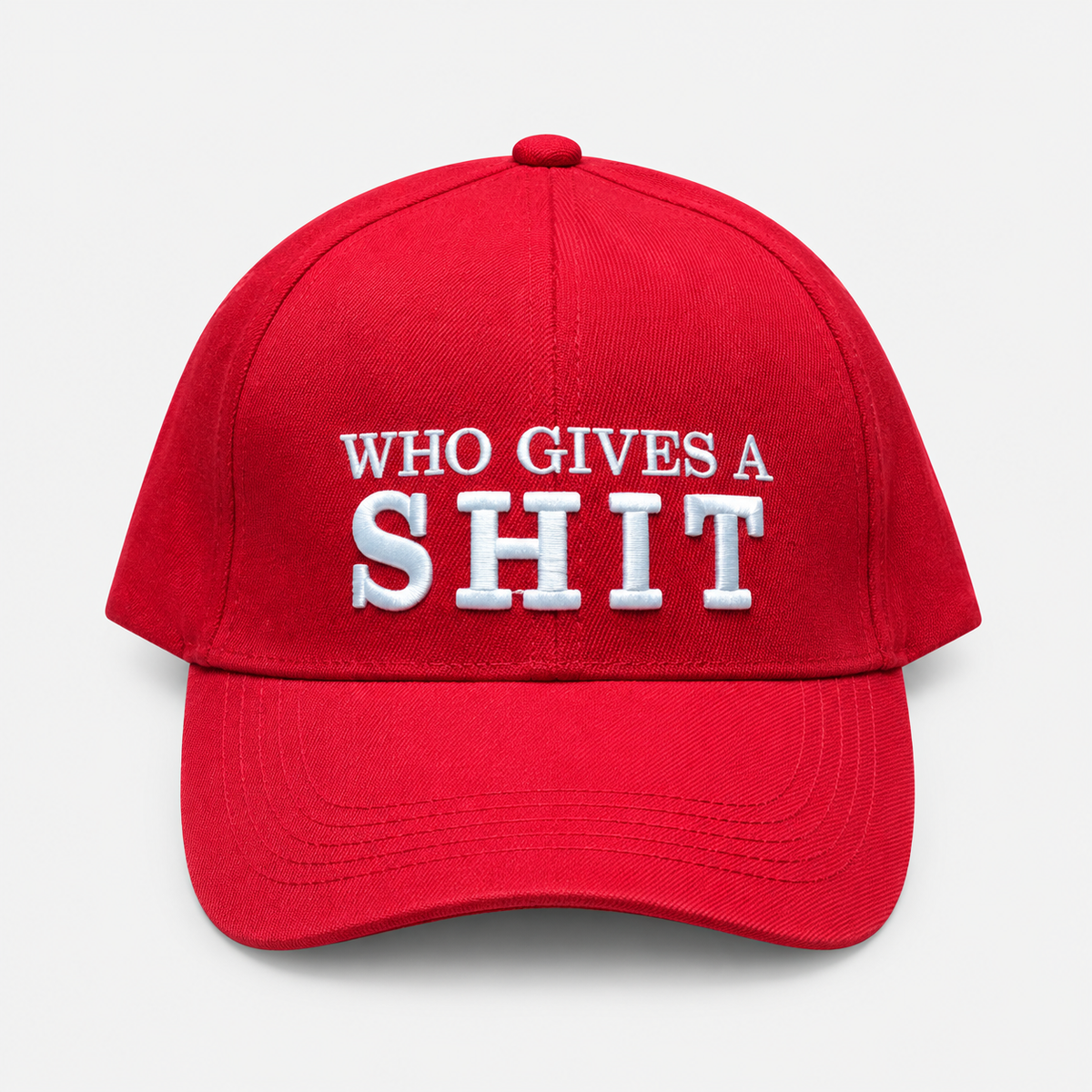 Red baseball cap with white Who Gives a Shit embroidery and a curved brim