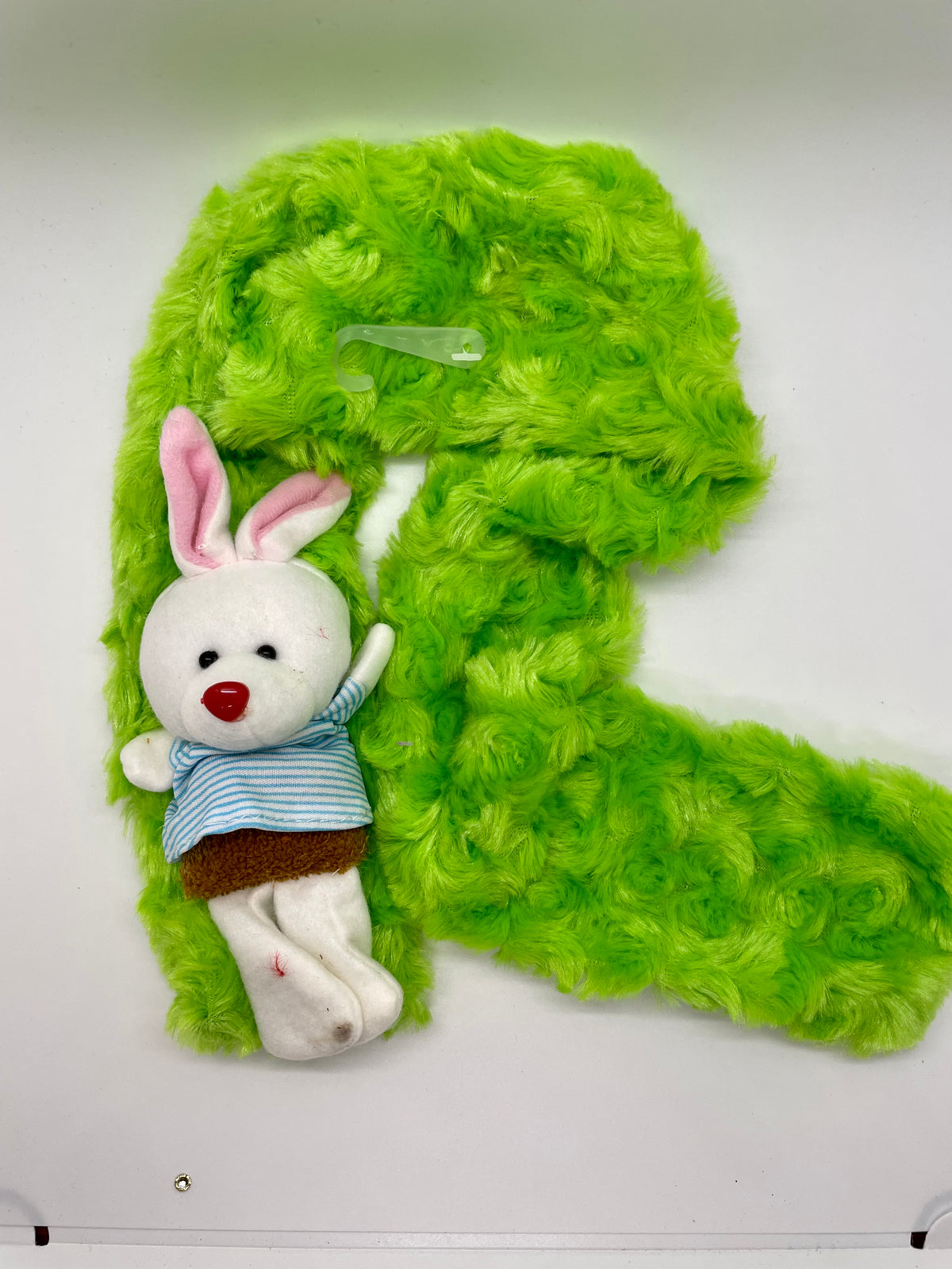 Green plush scarf with rabbit decoration