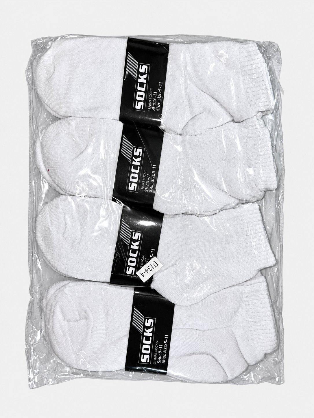 White men’s ankle socks in clear packaging