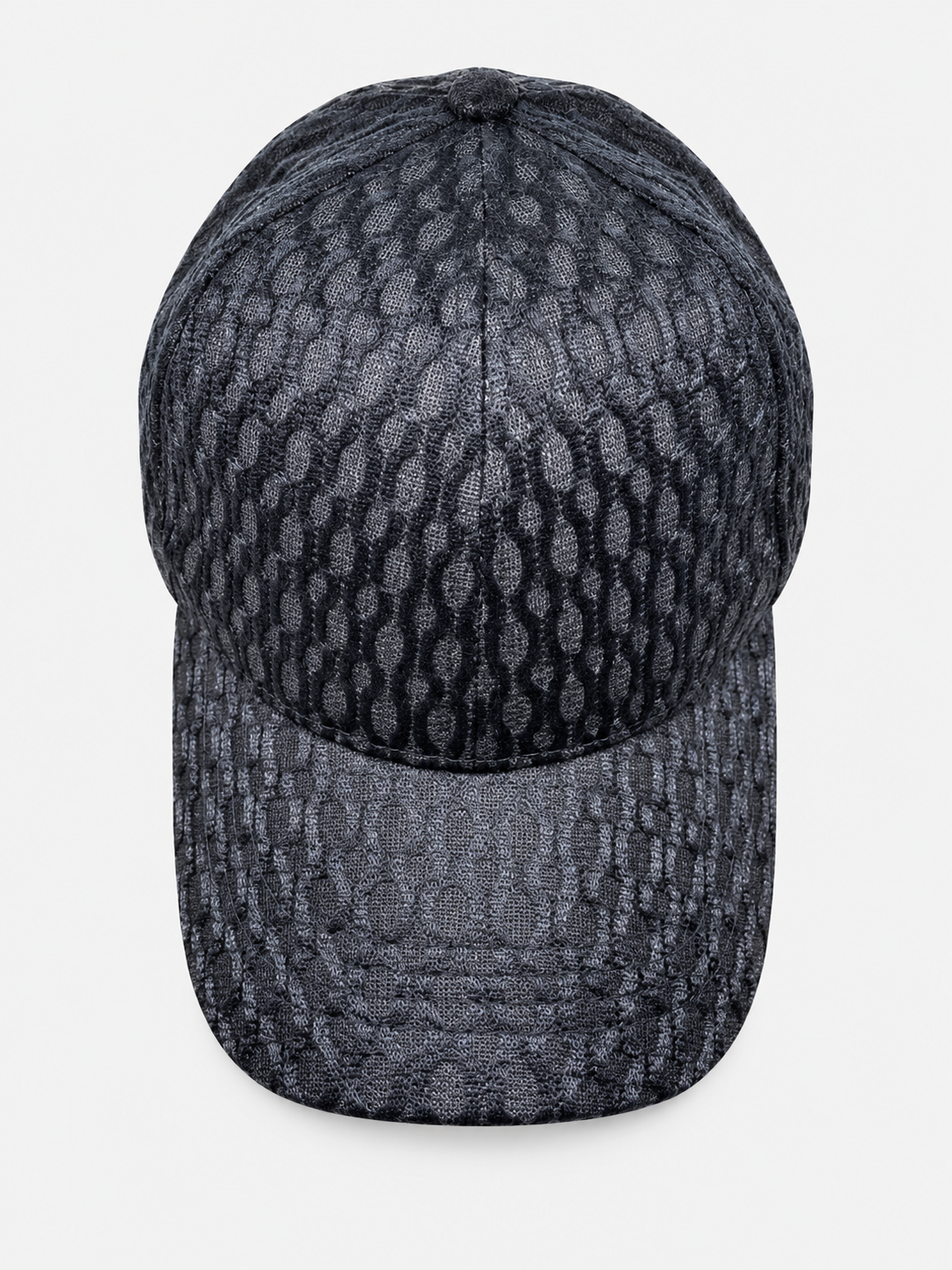 Navy netted baseball cap with oval pattern on a light gray background
