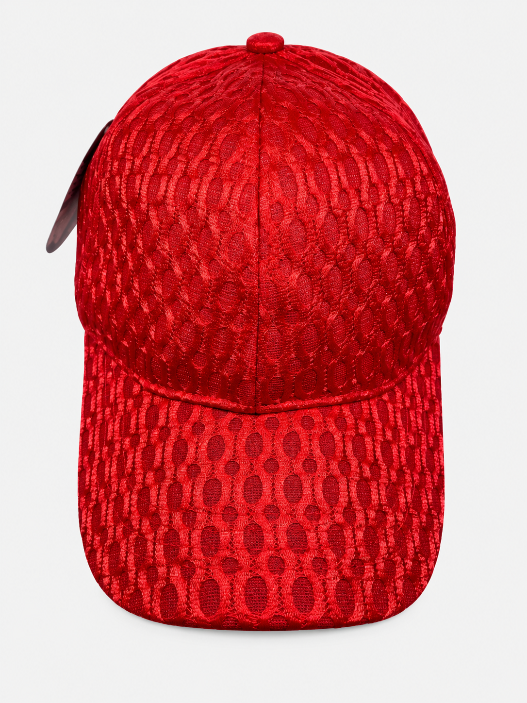 Red netted baseball cap with oval pattern on a light gray background