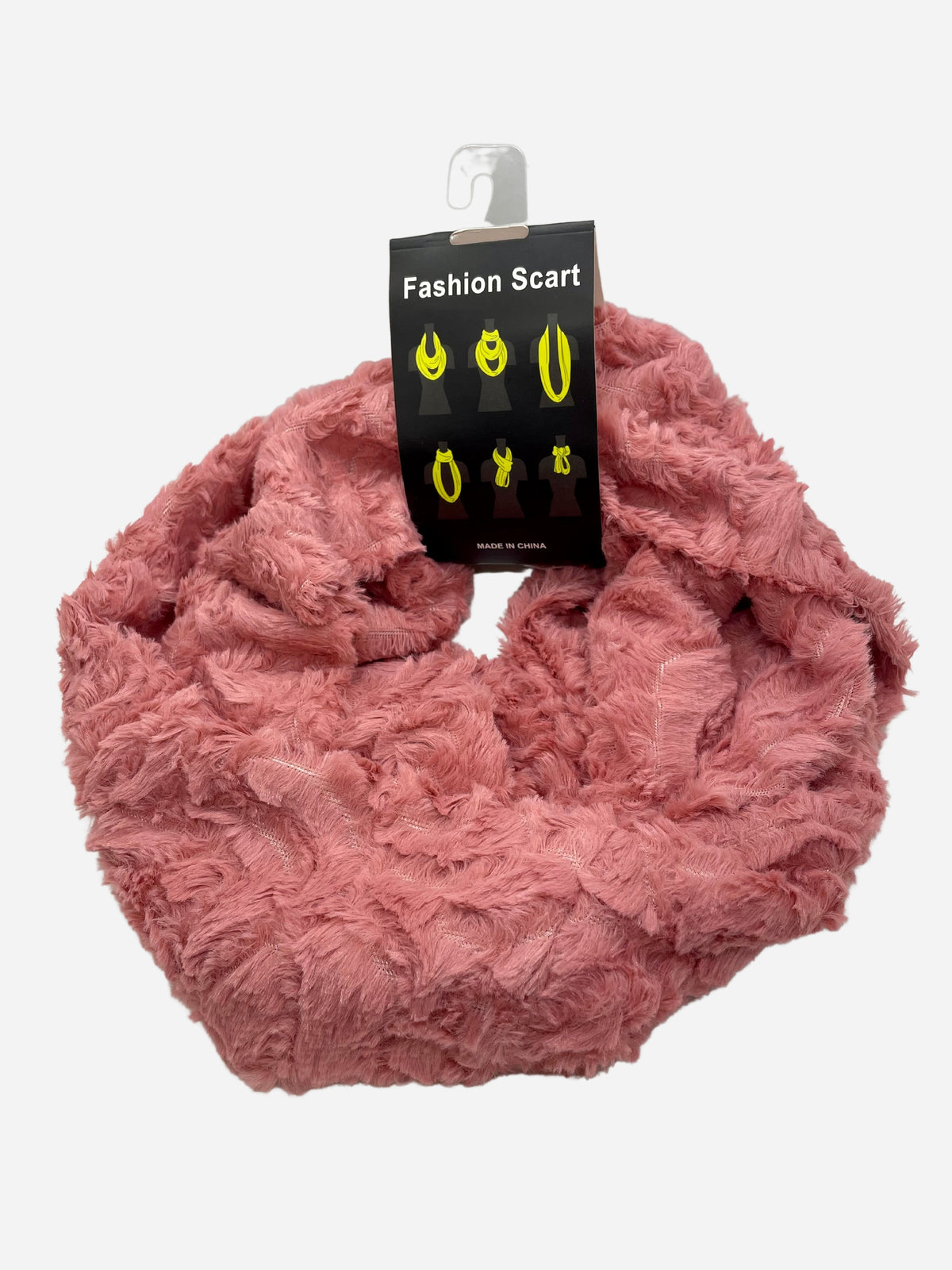 Pink plush infinity scarf arranged in a loop with a product tag